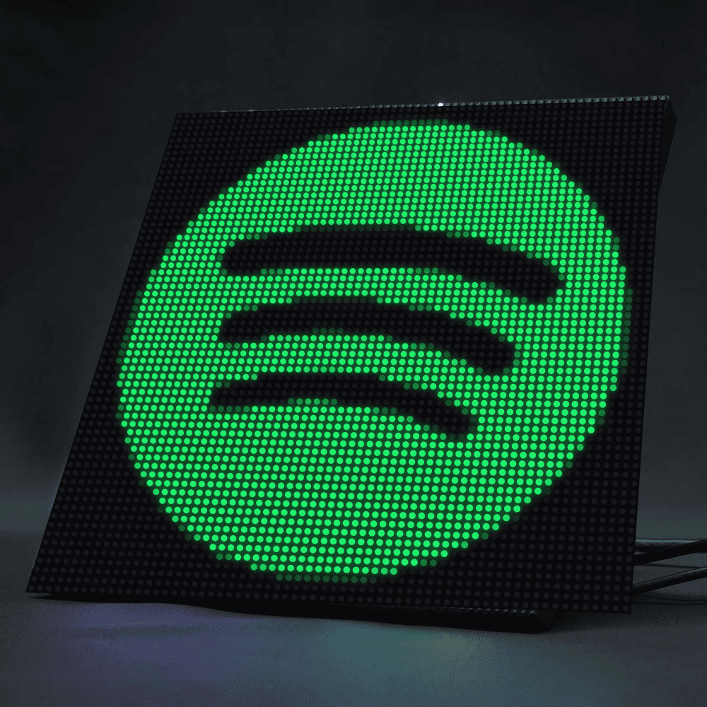 A 64×64 RGB LED matrix displaying a pixelated Spotify logo